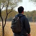 Traveler Hiroshi Tanaka observing wildlife